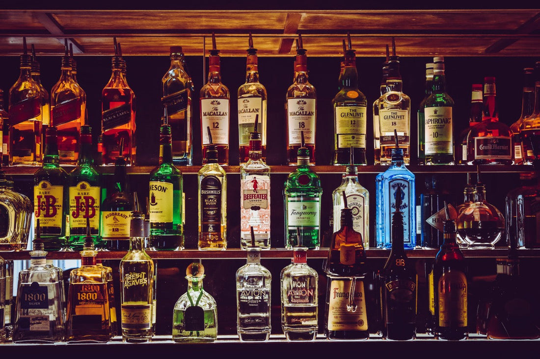 Different alcohol bottles on a shelf. Which one has the least histamines? Feels overwhelming.