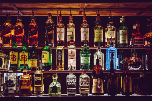 Different alcohol bottles on a shelf. Which one has the least histamines? Feels overwhelming.