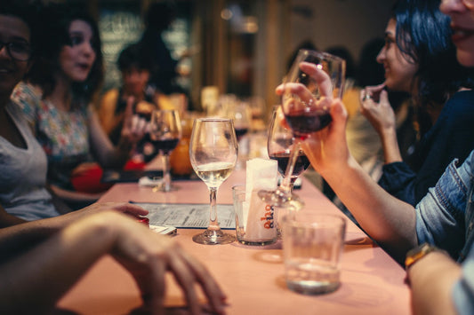 Friends enjoy a glass of sulfite free wine